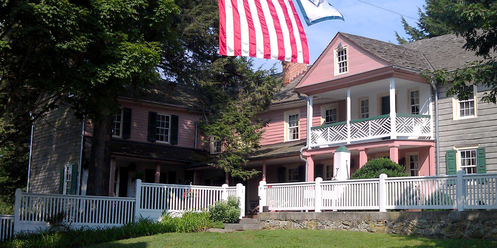 Union Mills historic house and flags