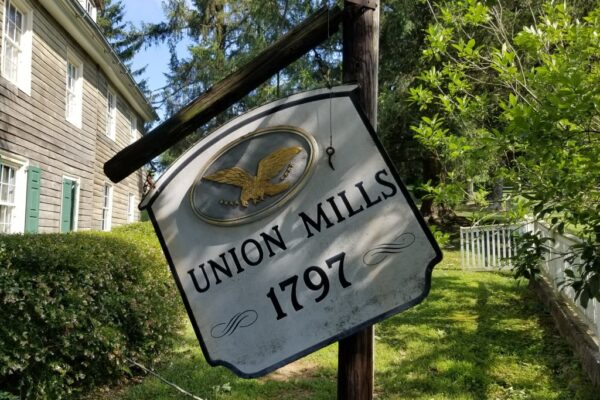 Damaged sign at the Union Mills Homestead